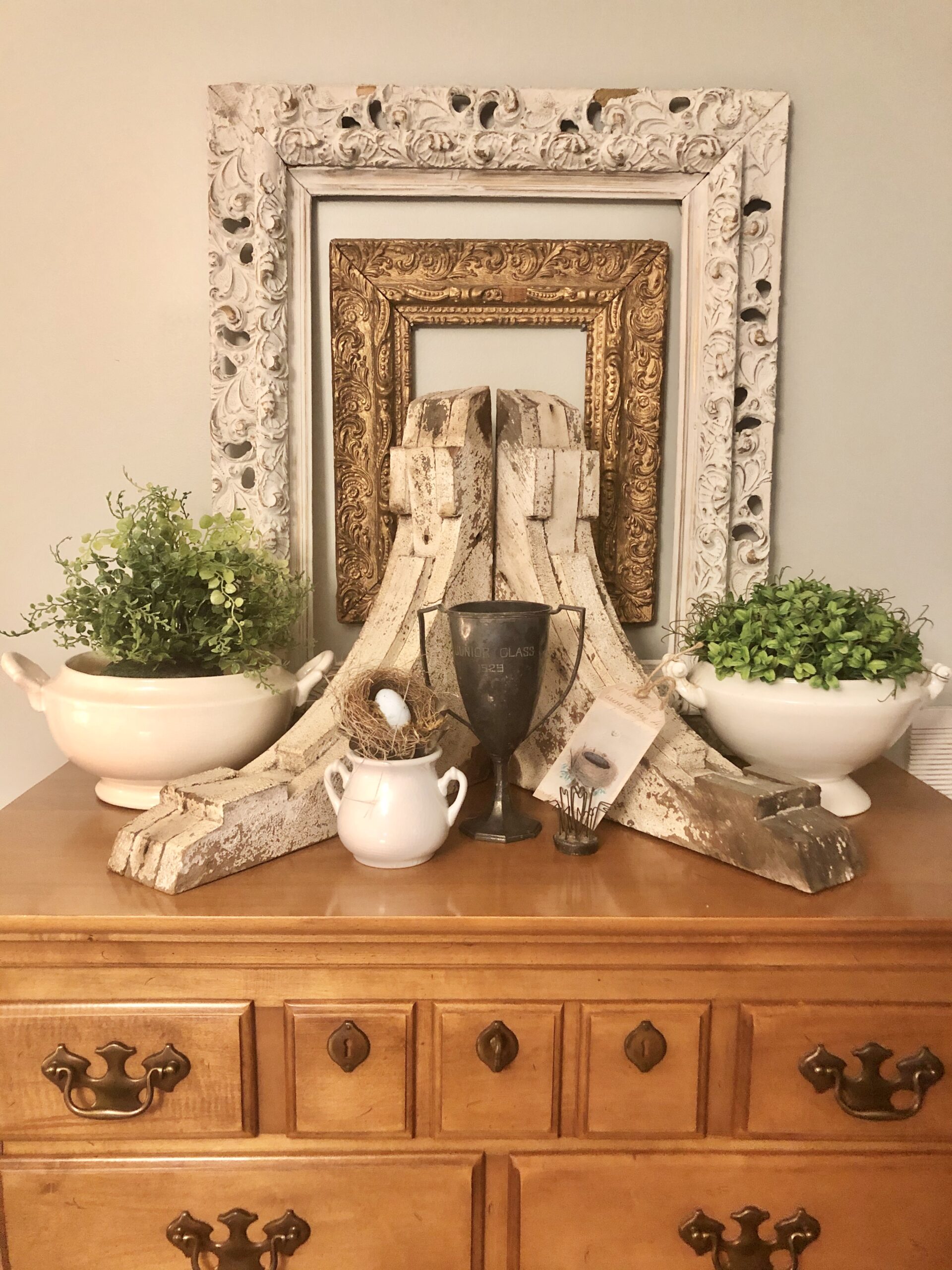 Antique corbels, frames, and a 1924 trophy cup 