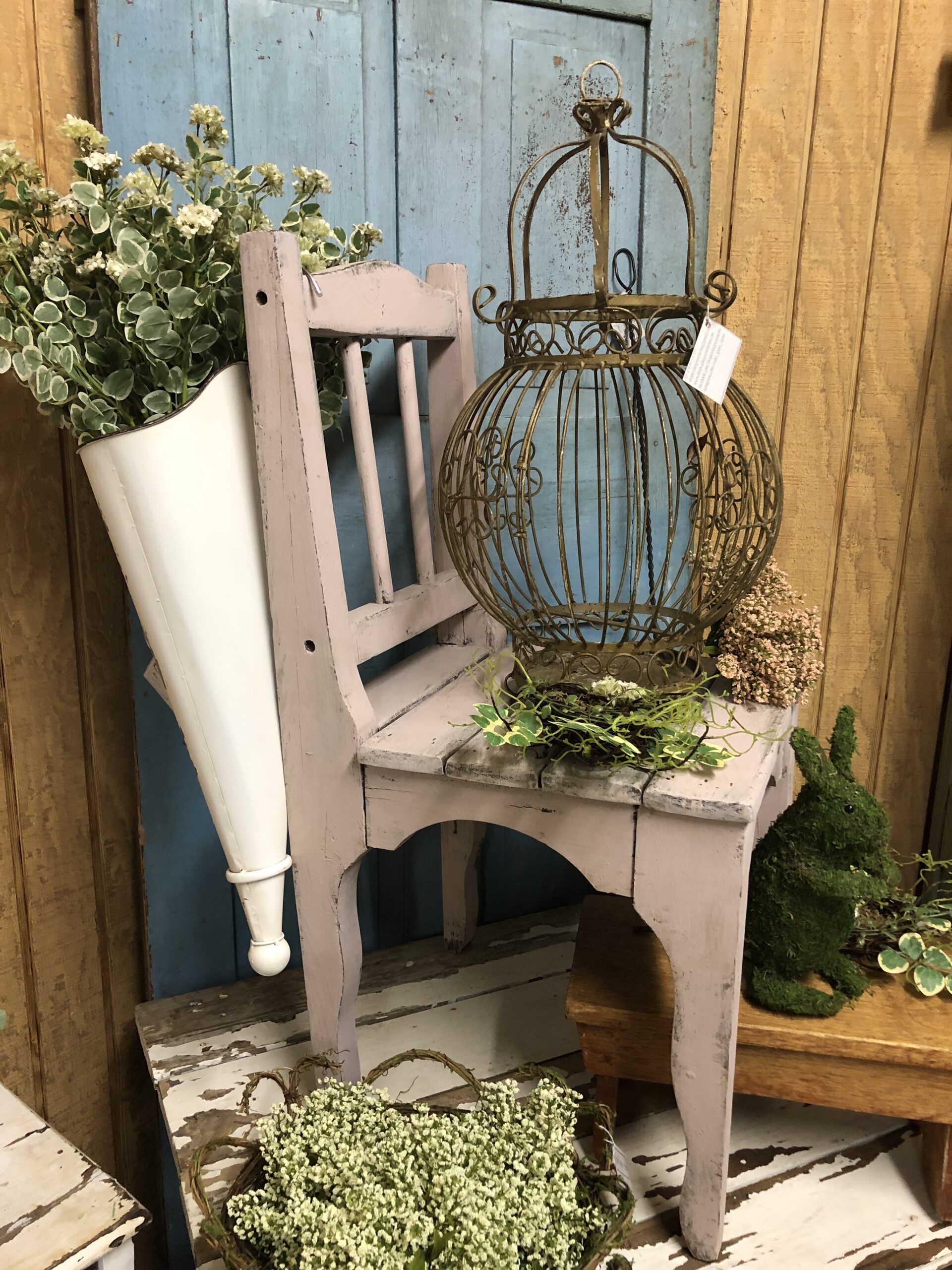 Antique iron birdcage, handmade vintage chair, and wooden peg door from PA.